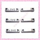  15 breloques LOVE en métal argentées 2.1cm