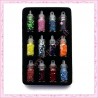 12 fioles en verre contenant des paillettes de diverses formes